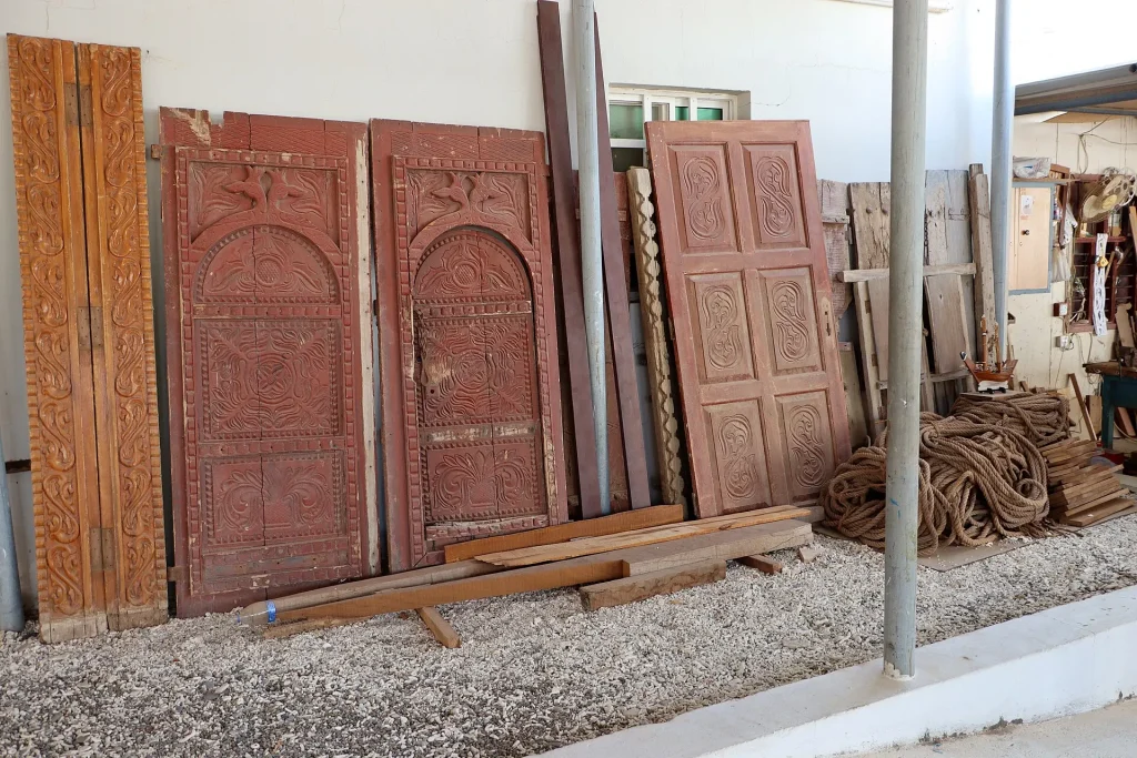 Carved wooden doors at the Sur dhow yard